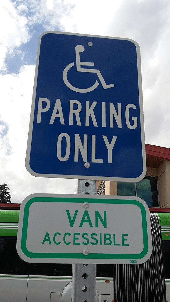 A sign for a handicap access vans handicap parking spot